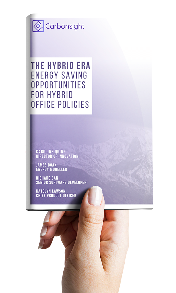 Hand holding a book about Carbonsight AI - The Hybrid Era - Energy Saving Opportunities For Hybrid Office Policies